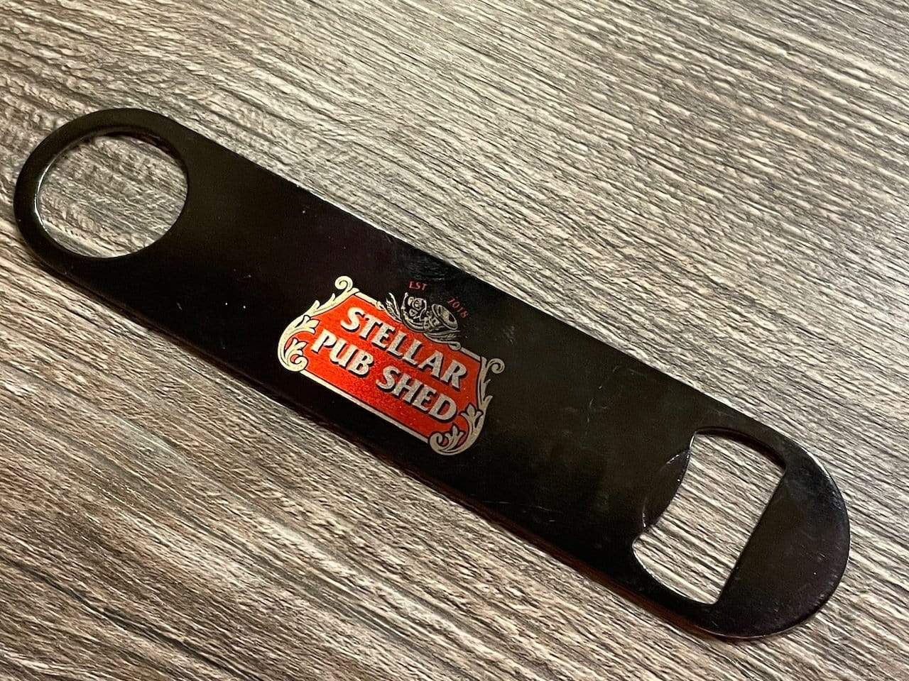 Stella Pub Shed Bottle Opener Raise the Bar Print and Design - Raise the Bar